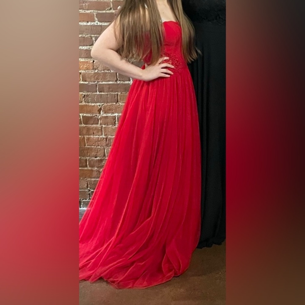 Red princess style halter top prom dress.